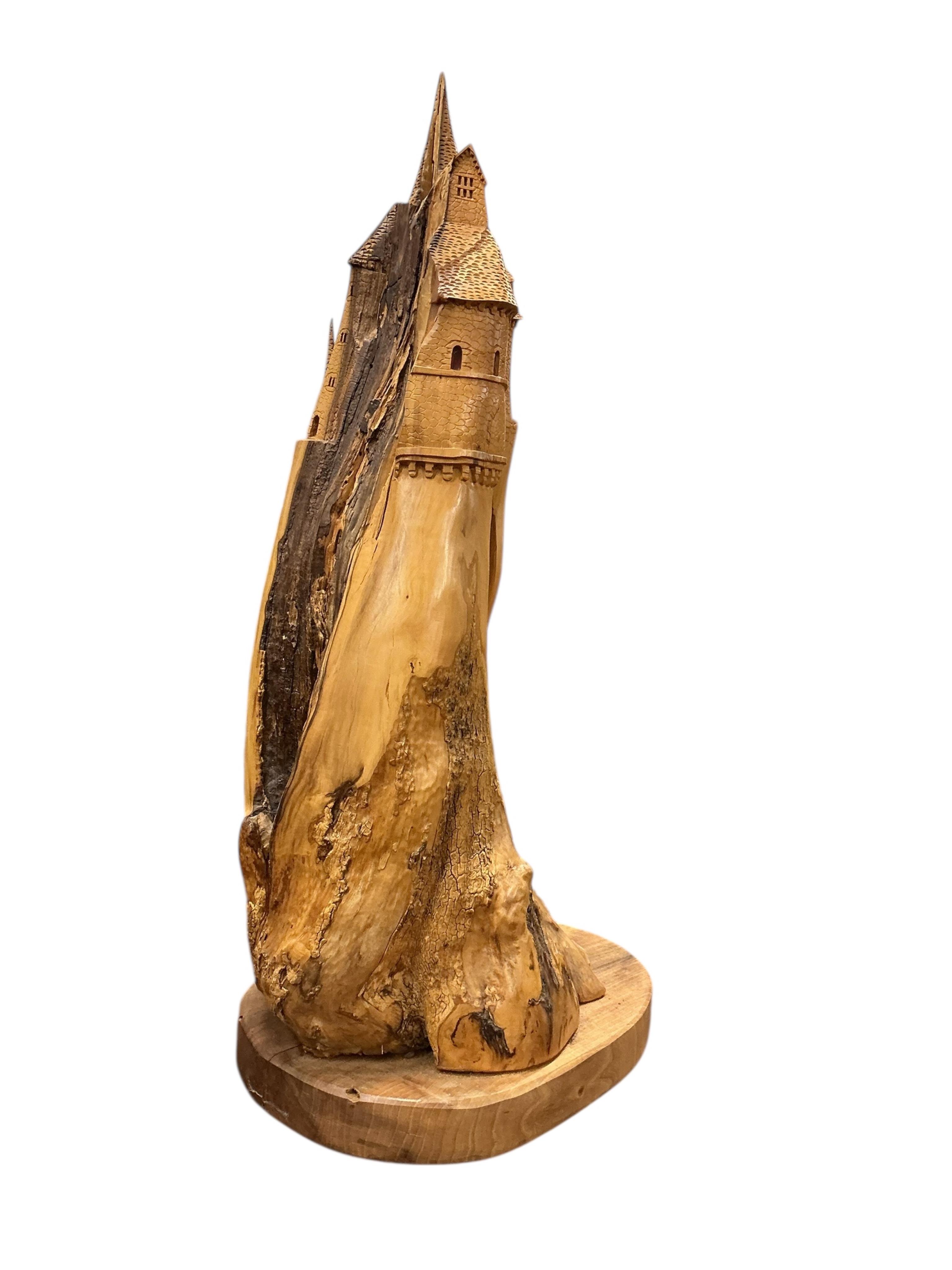 Pierre Decorse (b.1953), a naturalistically modelled sculpture of a fairytale castle emanating from rocks, height 84cm